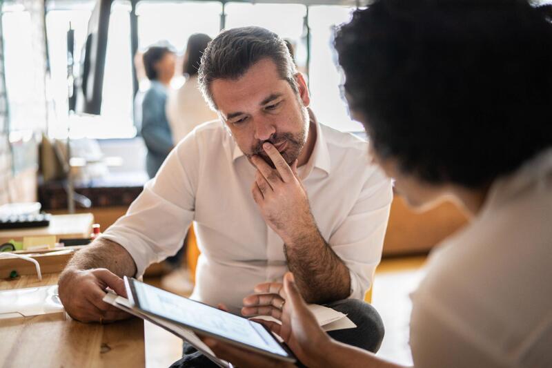 Manager providing feedback to his team member